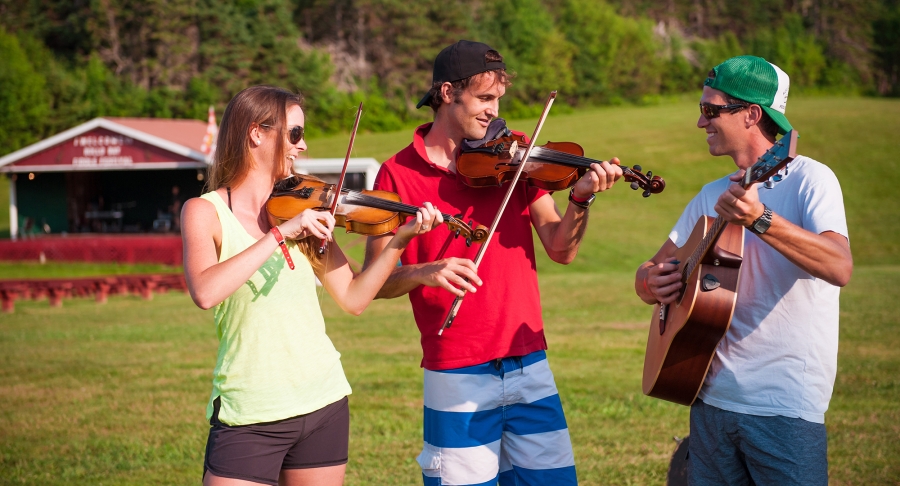 Group playing music, fiddle, guitar Group playing music, fiddle, guitar