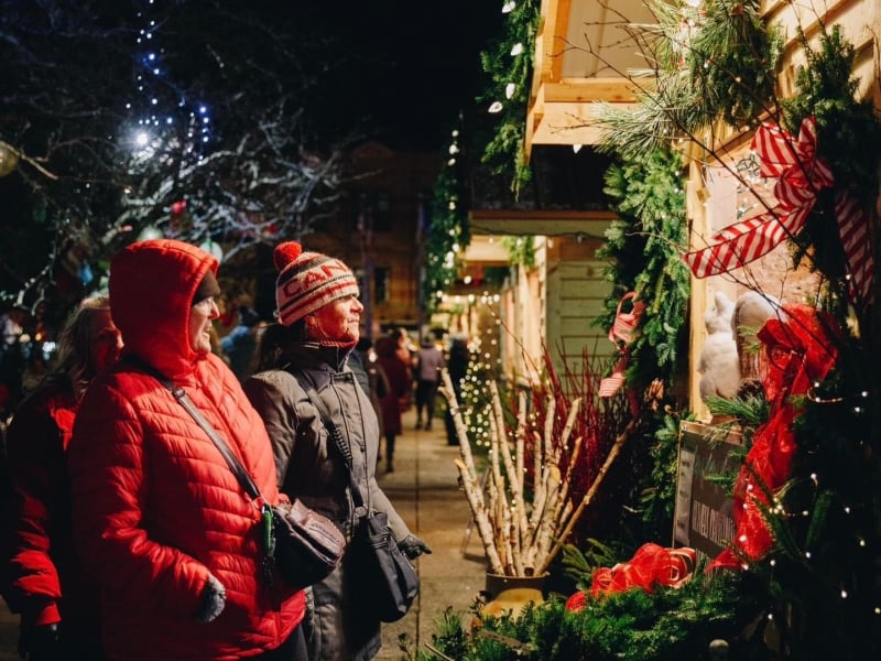 Two people stop at outdoor CHristmas shop in downtown Charlottetown