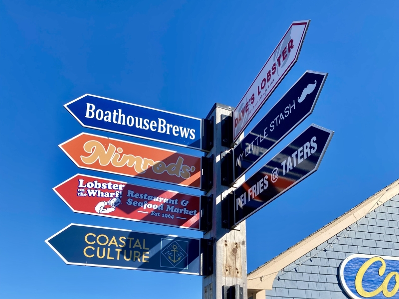 Directional signage at Peakes Quay on a blue sky day
