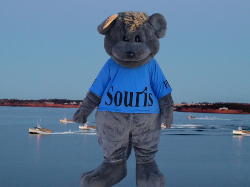 Souris the Mascot, PEI Souris the mascot with image of harbour and fishing boats in background